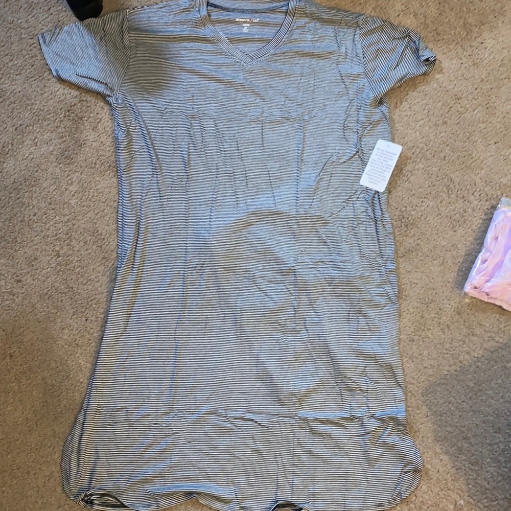 Black and white stripe long shirt and is short sleeved. Very soft